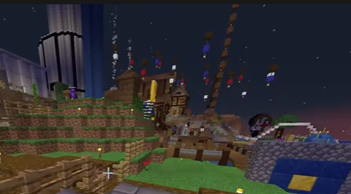 This is a screenshot of someone's stream. It shows L'manberg but there is a very tall tower in the center of the marketplace made out of spruce and dark oak. Torches sit along the side every few blocks. We are too far away to properly make out what it could be.